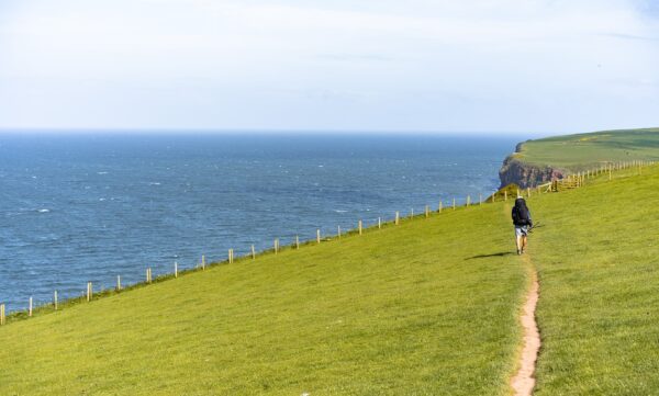 man hiking near the sea
