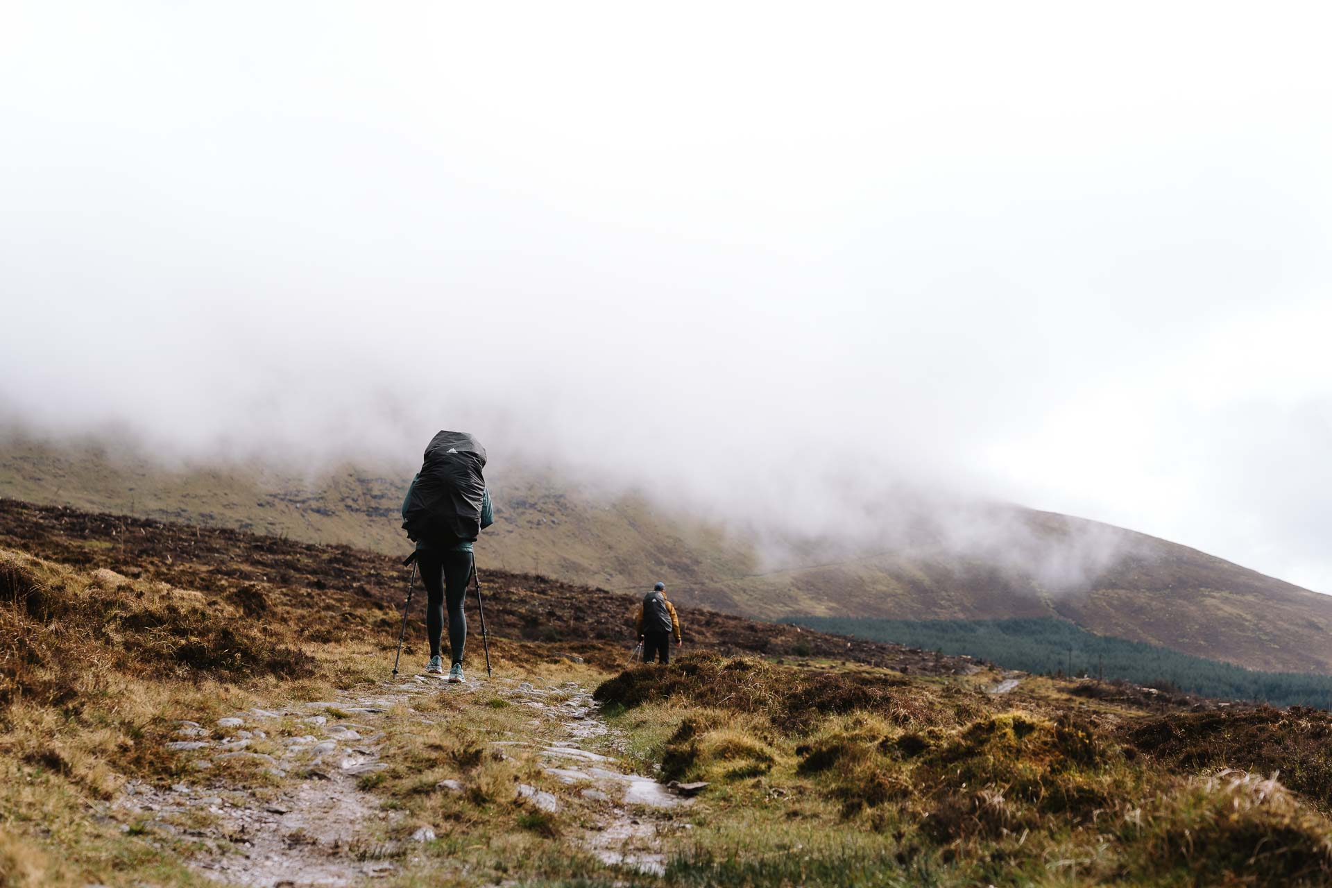 women walking through rain
