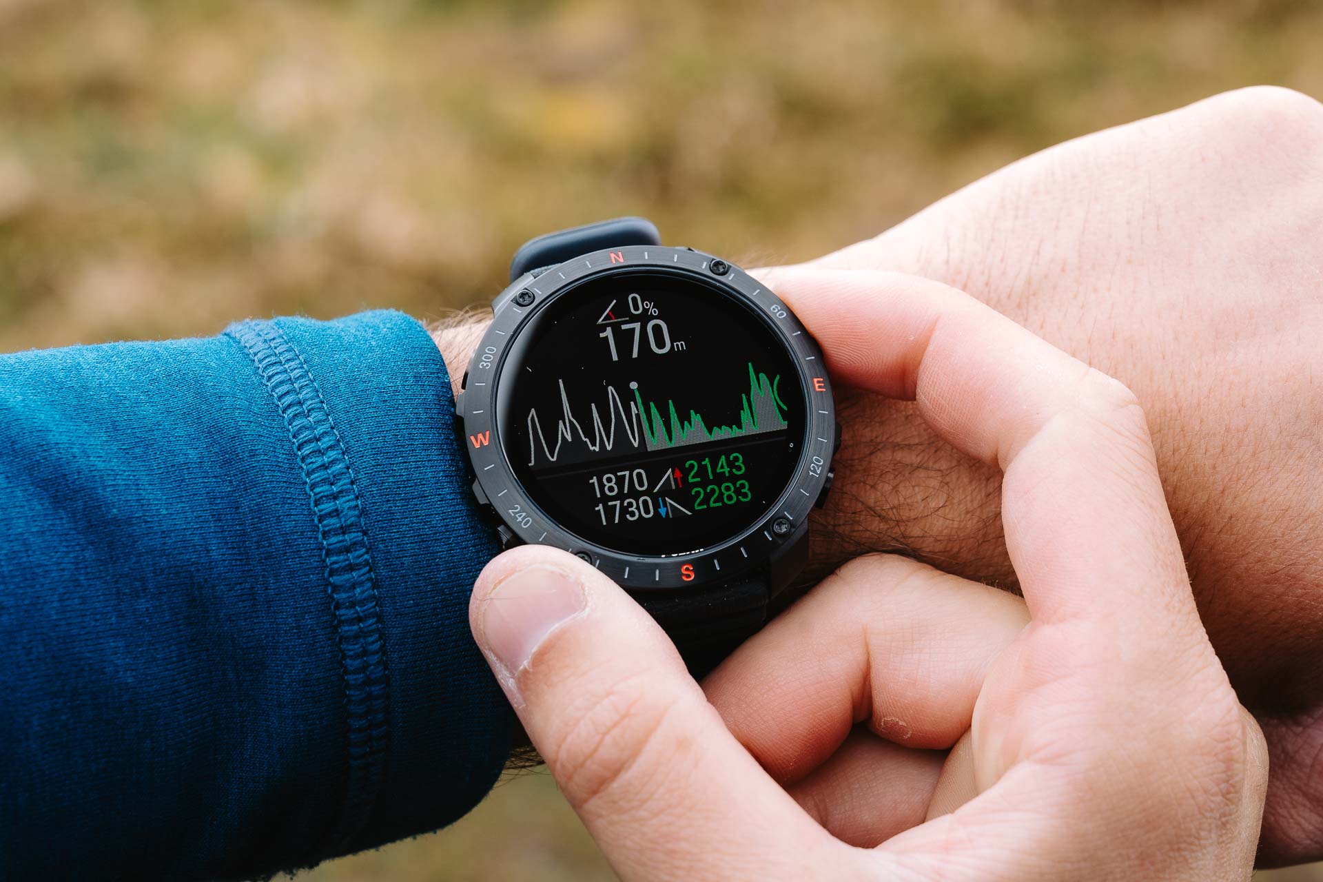 man changing settings on his watch