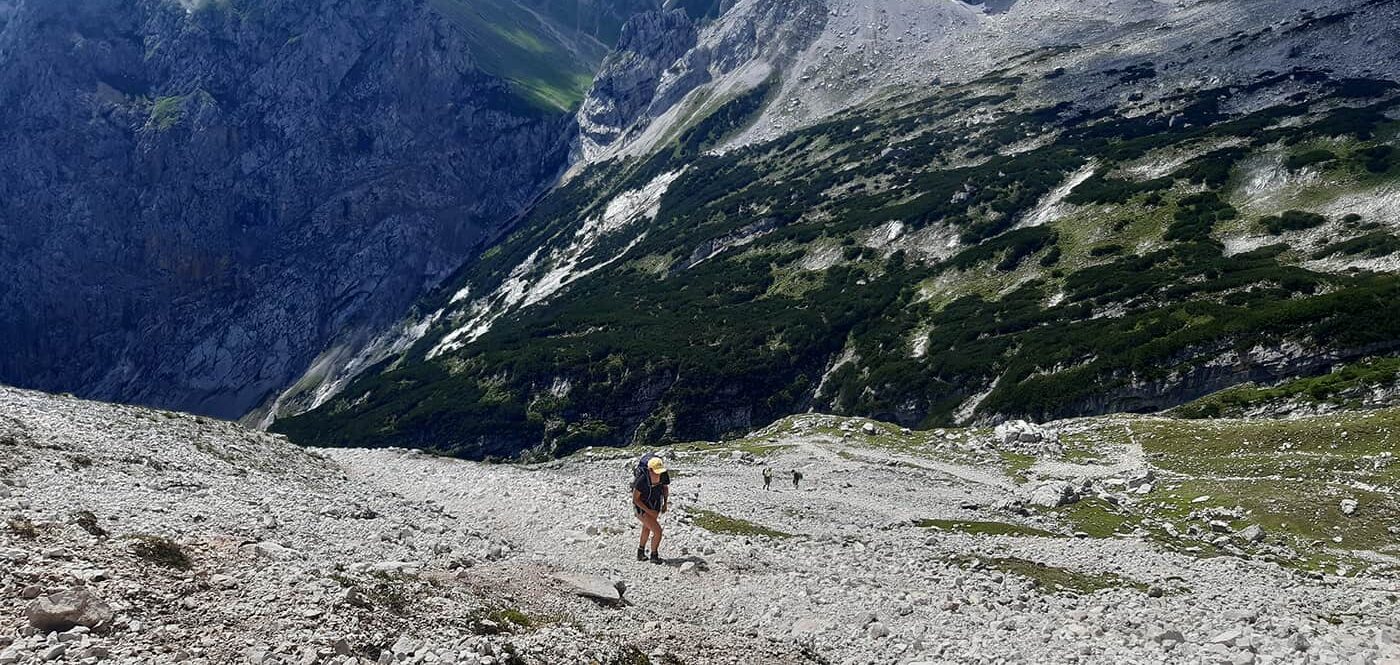 women hiking up mountain path